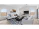 Bright and airy living room with neutral tones and an abundance of natural light at 23411 W Albeniz Pl, Buckeye, AZ 85326
