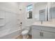 Bright bathroom with a tub, toilet, single sink vanity, and neutral paint at 28233 N 134Th Ave Ave, Peoria, AZ 85383