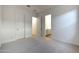 Neutral bedroom offering plush carpet, white walls, and an ensuite bathroom at 28233 N 134Th Ave Ave, Peoria, AZ 85383