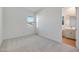 Bright bedroom featuring neutral walls, carpet floors, and a window for natural light at 28233 N 134Th Ave Ave, Peoria, AZ 85383