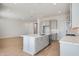 Bright kitchen featuring an island, stainless steel appliances, and an open concept design at 28233 N 134Th Ave Ave, Peoria, AZ 85383
