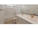A bright bathroom featuring double sinks and a shower-tub combination, providing a functional and stylish design at 34505 N Timberlake N Mnr, San Tan Valley, AZ 85144