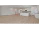 Open-concept living space with a kitchen featuring white cabinets and stainless steel appliances at 34505 N Timberlake N Mnr, San Tan Valley, AZ 85144