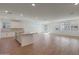 Spacious great room with tile floors, recessed lighting, and a kitchen island with granite countertops at 34505 N Timberlake N Mnr, San Tan Valley, AZ 85144