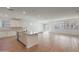 Modern kitchen with large island featuring granite countertops, stainless steel appliances, and access to outdoor living at 34505 N Timberlake N Mnr, San Tan Valley, AZ 85144