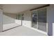 Covered patio boasts neutral concrete flooring and provides access to the home through sliding glass doors and multiple windows at 34505 N Timberlake N Mnr, San Tan Valley, AZ 85144