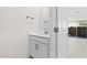 Modern bathroom featuring a white vanity, neutral walls, and a large mirror in a bright space at 7504 S 75Th Dr, Laveen, AZ 85339