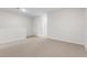 Minimalist bedroom showcasing neutral carpet and contemporary design at 7504 S 75Th Dr, Laveen, AZ 85339