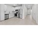A bright kitchen featuring stainless steel appliances and ample cabinet space at 7504 S 75Th Dr, Laveen, AZ 85339