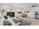 Inviting living space with sliding glass door, dining area, and neutral decor at 7504 S 75Th Dr, Laveen, AZ 85339