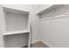 White walk-in closet with shelving and ample space for organized storage at 7504 S 75Th Dr, Laveen, AZ 85339
