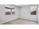 Comfortable bedroom with ample natural light from the windows and stylish flooring at 8975 S 168Th Ln, Goodyear, AZ 85338