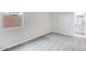 Empty bedroom with carpet flooring, a window, and an attached bathroom at 8975 S 168Th Ln, Goodyear, AZ 85338