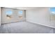 Bright, spacious bedroom with large windows, modern carpets and ample natural light, perfect for relaxation at 8975 S 168Th Ln, Goodyear, AZ 85338