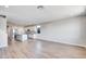 Open-concept living area with a modern kitchen island and stainless steel appliances, perfect for entertaining at 8975 S 168Th Ln, Goodyear, AZ 85338