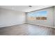 Spacious living area with abundant natural light, modern flooring, and recessed lighting at 8975 S 168Th Ln, Goodyear, AZ 85338