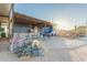 Inviting outdoor space featuring covered bar with seating and a concrete-tile patio, perfect for entertaining at 10120 E Mclellan Rd, Mesa, AZ 85207