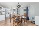 Cozy dining area with a modern chandelier, wooden table, and seating for four at 10120 E Mclellan Rd, Mesa, AZ 85207