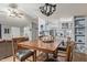 Open dining area with wooden table, chairs, and view of the living room and kitchen at 10120 E Mclellan Rd, Mesa, AZ 85207