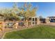 Well-maintained dog run with artificial turf and shaded shelter at 10120 E Mclellan Rd, Mesa, AZ 85207