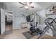 Bright exercise room with a ceiling fan, exercise bike, and inversion table at 10120 E Mclellan Rd, Mesa, AZ 85207