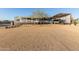 Inviting single-story home with covered porch and convenient carport for boat storage at 10120 E Mclellan Rd, Mesa, AZ 85207