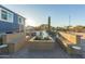 Inviting outdoor firepit area with built-in seating and desert landscape at 10120 E Mclellan Rd, Mesa, AZ 85207