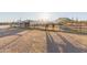 Another view of horses in the horse pen, with desert views at 10120 E Mclellan Rd, Mesa, AZ 85207