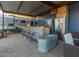 Spacious outdoor covered bar area with a refrigerator and nearby camper at 10120 E Mclellan Rd, Mesa, AZ 85207