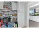 Organized walk-in pantry with shelving for food storage and household supplies at 10120 E Mclellan Rd, Mesa, AZ 85207