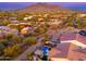 Aerial view of a home with pool and surrounding desert landscape at 34801 N 53Rd St # 26, Cave Creek, AZ 85331