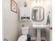 Elegant powder room with pedestal sink and white fixtures at 34801 N 53Rd St # 26, Cave Creek, AZ 85331