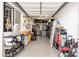 Garage workshop area with ample storage shelving at 34801 N 53Rd St # 26, Cave Creek, AZ 85331