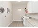 Laundry room with granite countertop and built-in shelving at 34801 N 53Rd St # 26, Cave Creek, AZ 85331