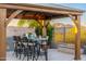 Covered patio with a built-in grill and fire pit at 34801 N 53Rd St # 26, Cave Creek, AZ 85331