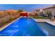 L shaped pool with blue led lighting, and a spacious patio at 34801 N 53Rd St # 26, Cave Creek, AZ 85331