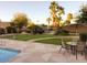 Community pool area with multiple seating areas and lush landscaping providing a resort style living at 4026 E Larkspur Dr, Phoenix, AZ 85032