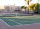 An empty community tennis court, ideal for active residents, set within a well-maintained community space at 4026 E Larkspur Dr, Phoenix, AZ 85032