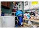 Laundry room with washer, dryer, and storage shelves at 4625 E Southgate Ave, Phoenix, AZ 85040