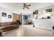 Bright living room with tile floors, sofa, and ceiling fan at 4625 E Southgate Ave, Phoenix, AZ 85040