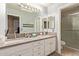 Bathroom with double vanity, granite countertops, and shower at 5827 W Charter Oak Rd, Glendale, AZ 85304