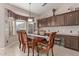 Kitchen breakfast nook with built-in seating and window views at 5827 W Charter Oak Rd, Glendale, AZ 85304