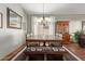 Bright dining area with chandelier and wood furniture at 5827 W Charter Oak Rd, Glendale, AZ 85304