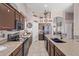 Modern kitchen with granite countertops, stainless steel appliances, and ample cabinet space at 5827 W Charter Oak Rd, Glendale, AZ 85304