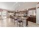 Spacious kitchen with island and dark wood cabinets at 5827 W Charter Oak Rd, Glendale, AZ 85304