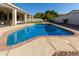 Inviting kidney-shaped pool with brick coping and patio at 5827 W Charter Oak Rd, Glendale, AZ 85304