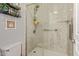 Walk-in shower with glass enclosure and grab bar at 5827 W Charter Oak Rd, Glendale, AZ 85304