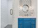 Stylish bathroom with white subway tile and a blue vanity at 6319 E Mariposa St, Scottsdale, AZ 85251