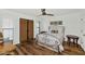 Guest bedroom with hardwood floors and an ornate bed frame at 6319 E Mariposa St, Scottsdale, AZ 85251