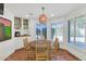 Bright breakfast nook with built-in shelving and wood table at 6319 E Mariposa St, Scottsdale, AZ 85251